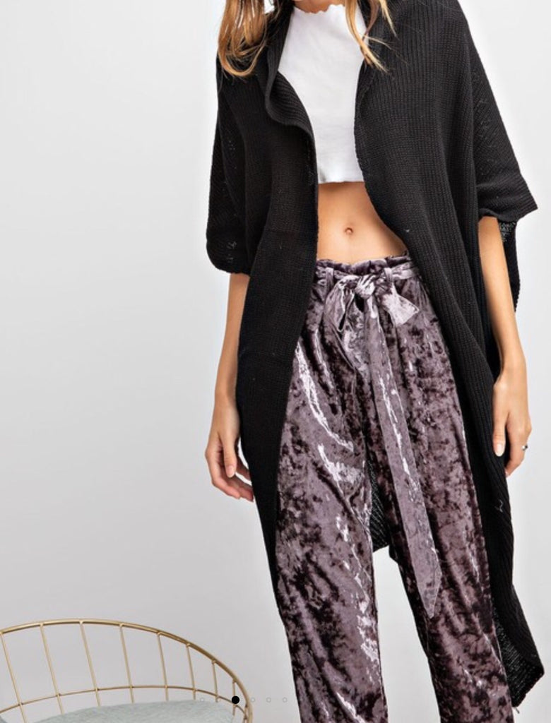 Black- knitted sweater cardigan with asymmetrical hem and pockets