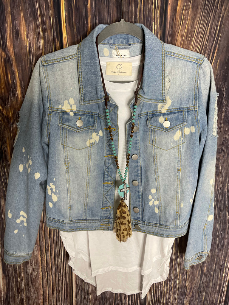 Light washed destructive denim jacket